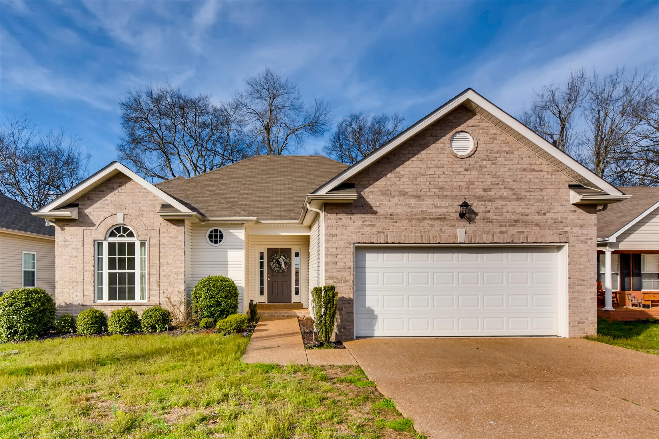 1054 Golf View Way Spring Hill, TN 37174 - Photo 1 of 16 a view of a house with backyard and trees