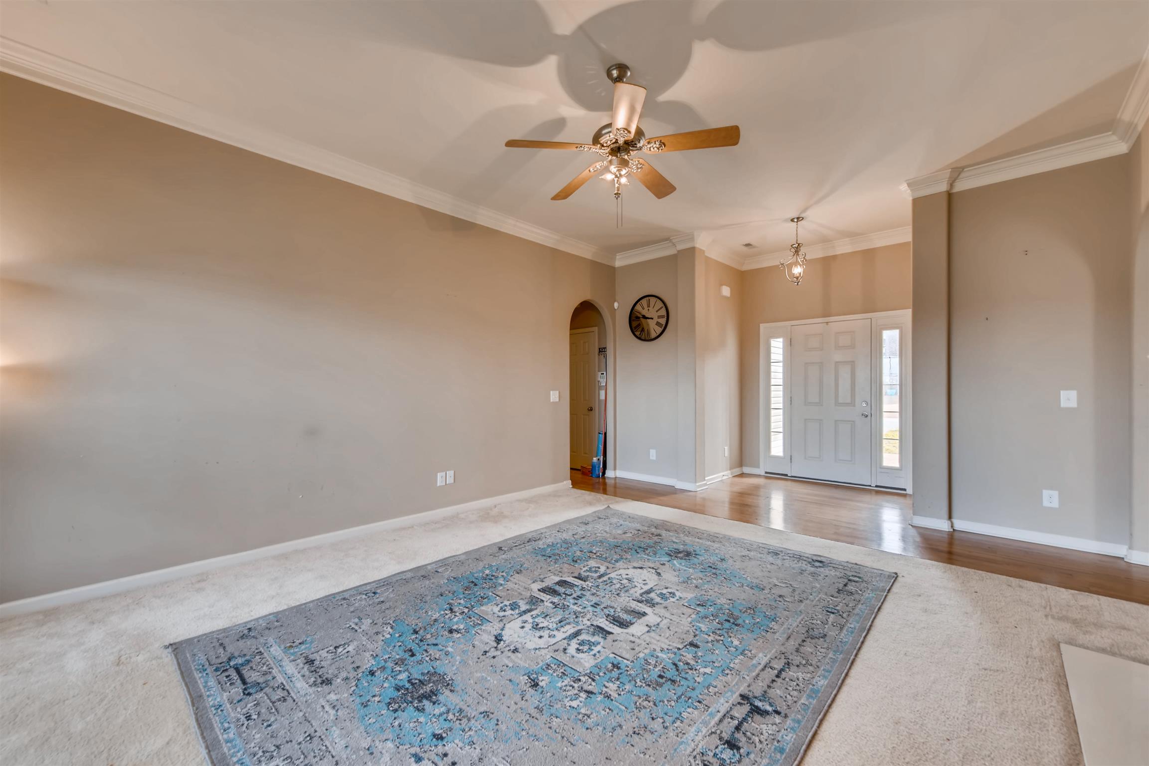 1054 Golf View Way Spring Hill, TN 37174 - Photo 4 of 16 a view of a big room with wooden floor and a chandelier fan