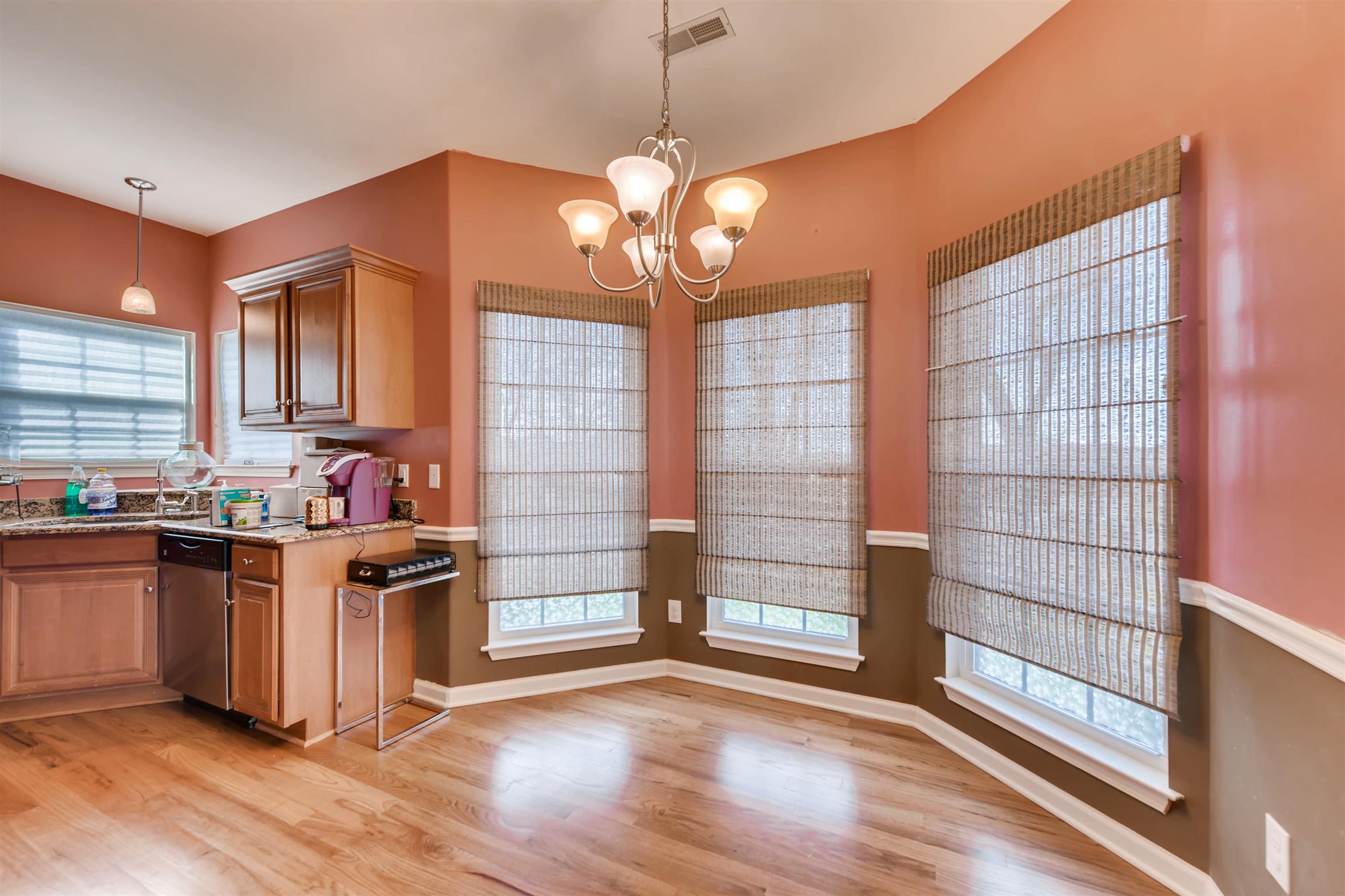 1054 Golf View Way Spring Hill, TN 37174 - Photo 5 of 16 a kitchen with stainless steel appliances granite countertop a stove and a sink