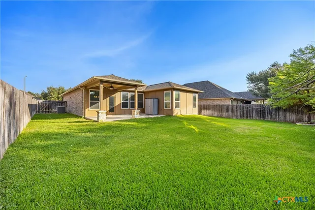 a view of a house with a big yard