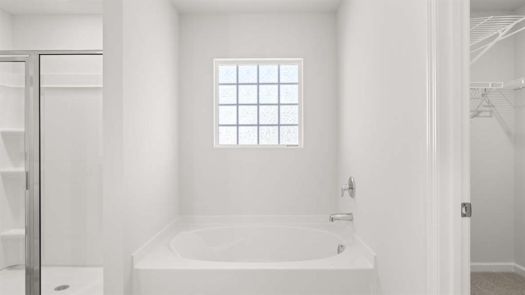 6068 Knickerbocker Street Mableton, GA 30126 - Photo 12 of 15 a white bath tub with a window