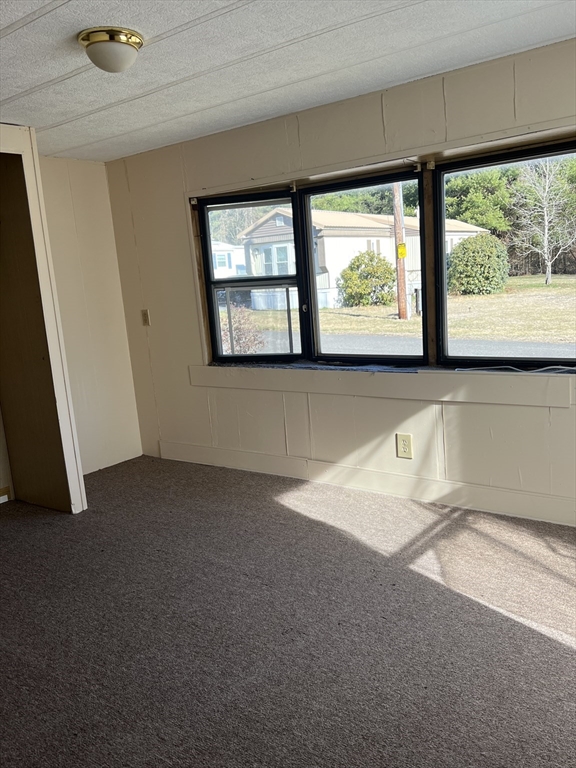 51 Monson Turnpike Road, Unit 1042 Ware, MA 01082 - Photo 14 of 14 a view of an empty room with a window
