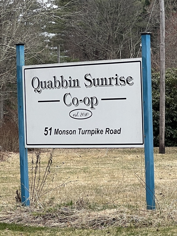 51 Monson Turnpike Road, Unit 1042 Ware, MA 01082 - Photo 2 of 14 a sign that is on the side of a building