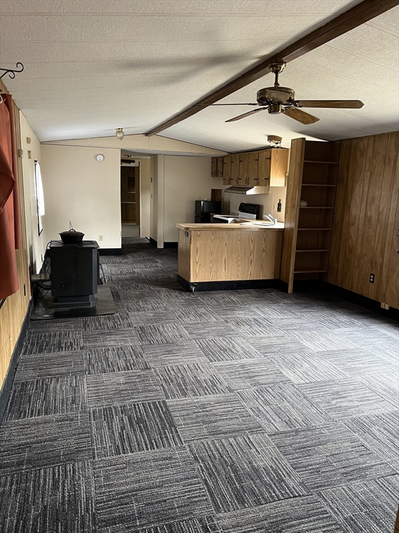 51 Monson Turnpike Road, Unit 1042 Ware, MA 01082 - Photo 5 of 14 a living room with furniture and a flat screen tv