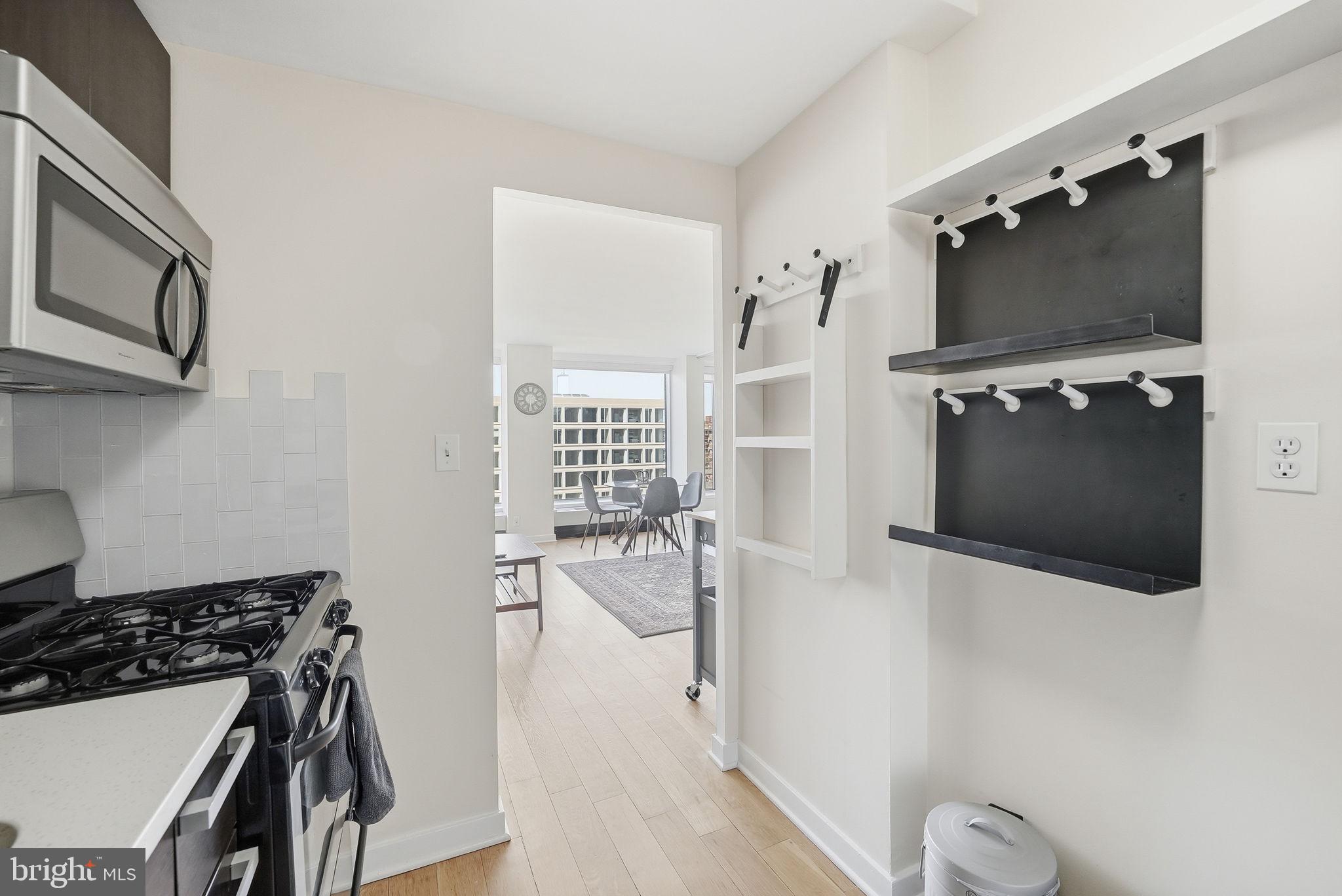 1101 3rd Street Southwest, Unit 701 Washington, DC 20024 - Photo 2 of 18 a view of a livingroom with furniture and flat screen tv