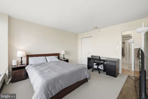 a bedroom with a bed and furniture