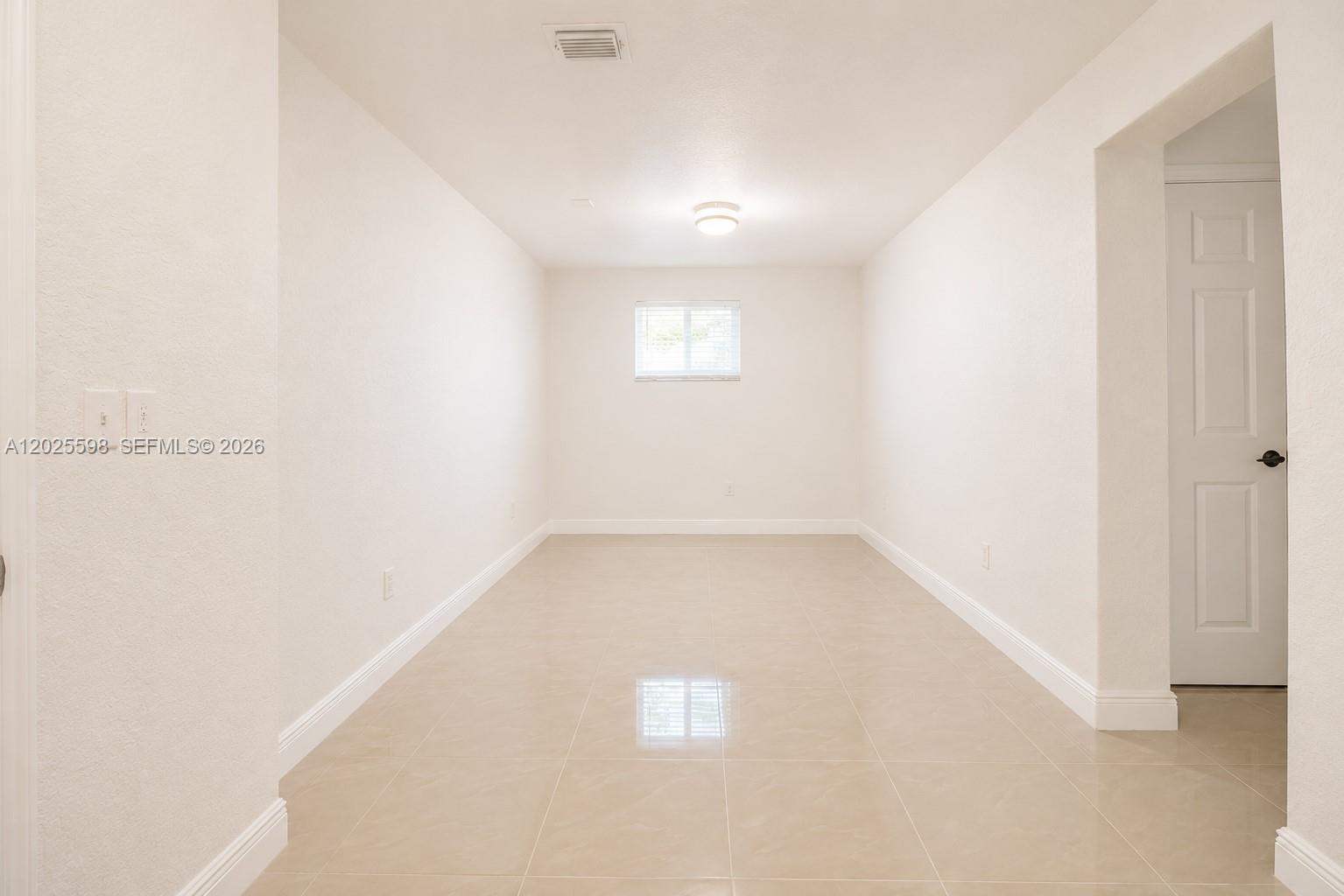 9421 Southwest 150th Street Miami, FL 33176 - Photo 19 of 31 a view of an empty room