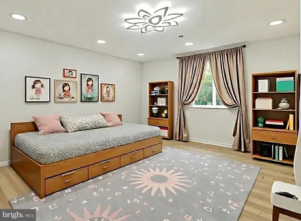 a spacious bedroom with a bed and a cabinets
