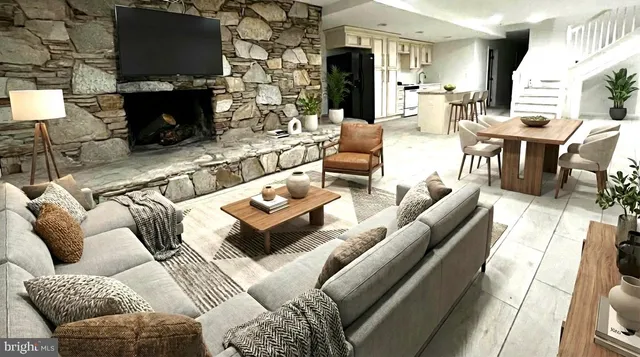 a living room with furniture a fireplace and a flat screen tv