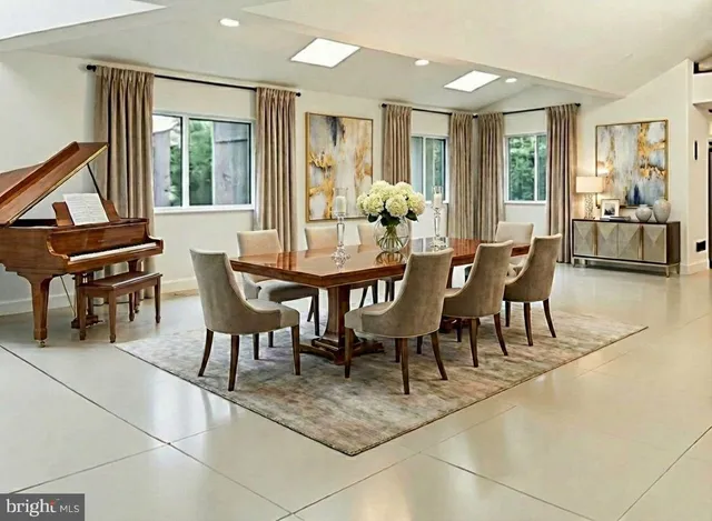a view of a dining room with furniture and window