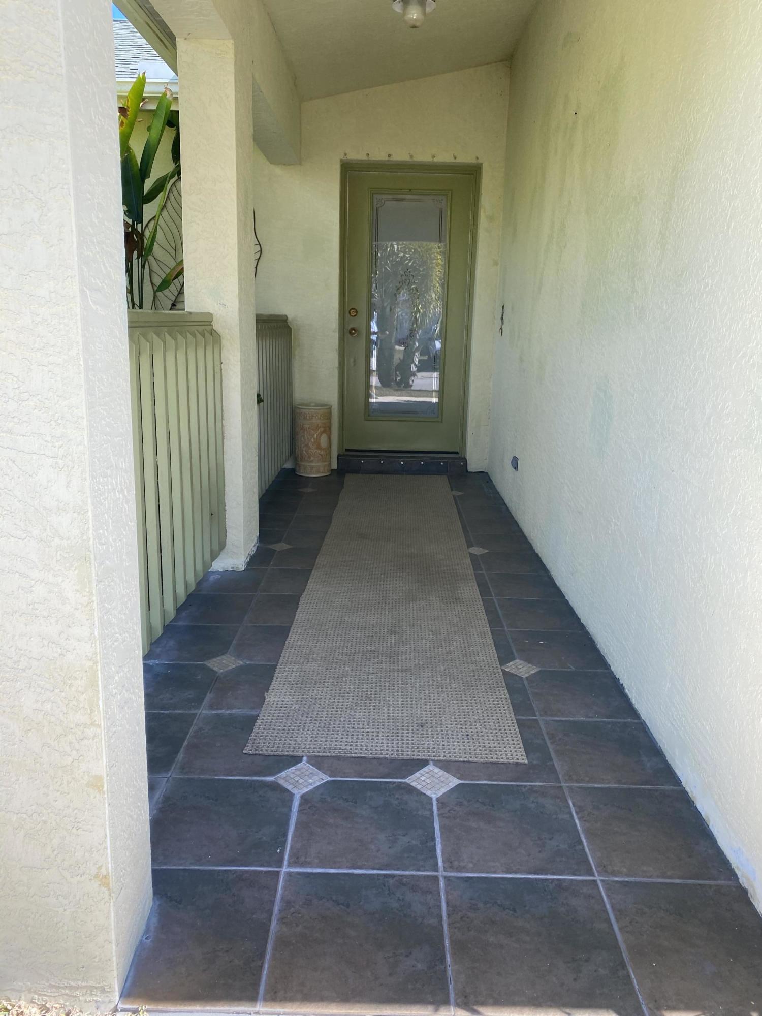 5300 Seagrape Drive Fort Pierce, FL 34982 - Photo 3 of 25 Covered Entry Way