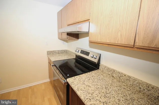 a kitchen with a stove and a microwave
