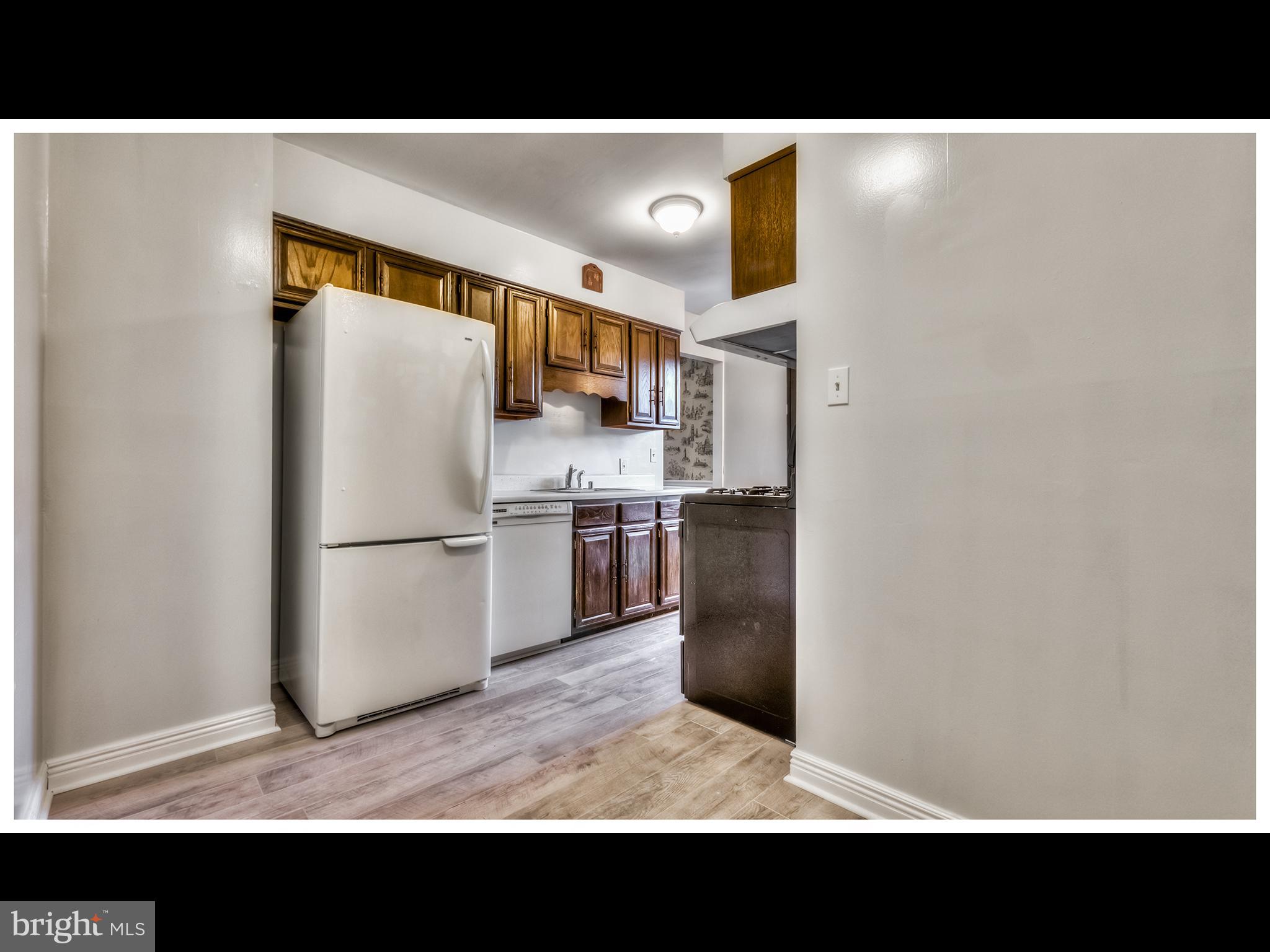 2324 Old Frederick Road Baltimore, MD 21228 - Photo 22 of 44 a black and white photo of a open kitchen