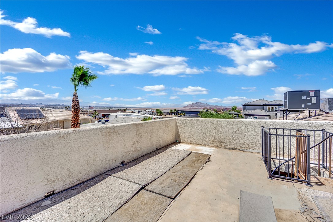 420 North Racetrack Road Henderson, NV 89015 - Photo 49 of 52 A rooftop terrace provides an elevated perspective of the surrounding landscape and distant mountains.