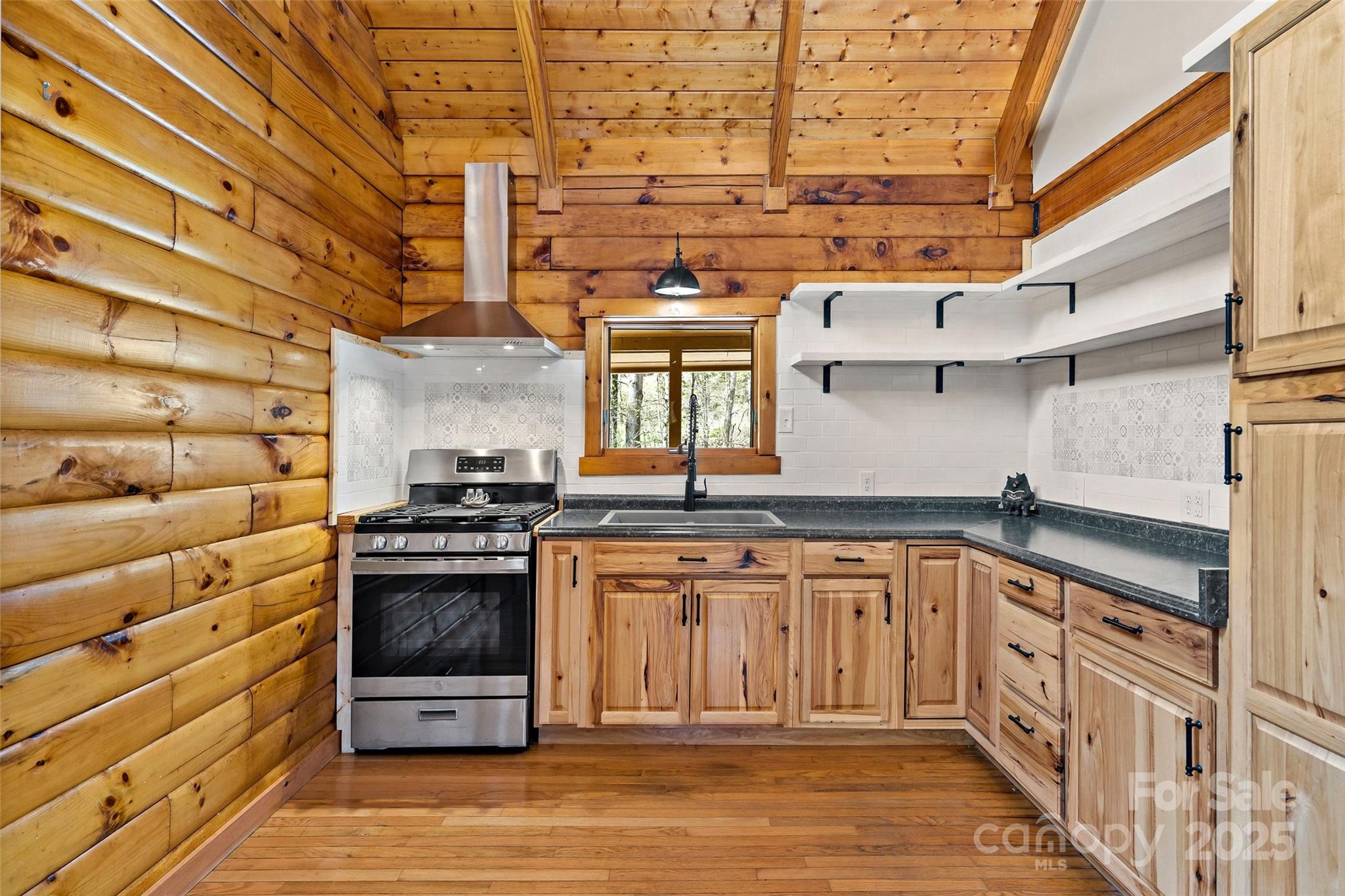580 Red Dirt Road Newland, NC 28657 - Photo 13 of 48 a kitchen with a stove and a sink