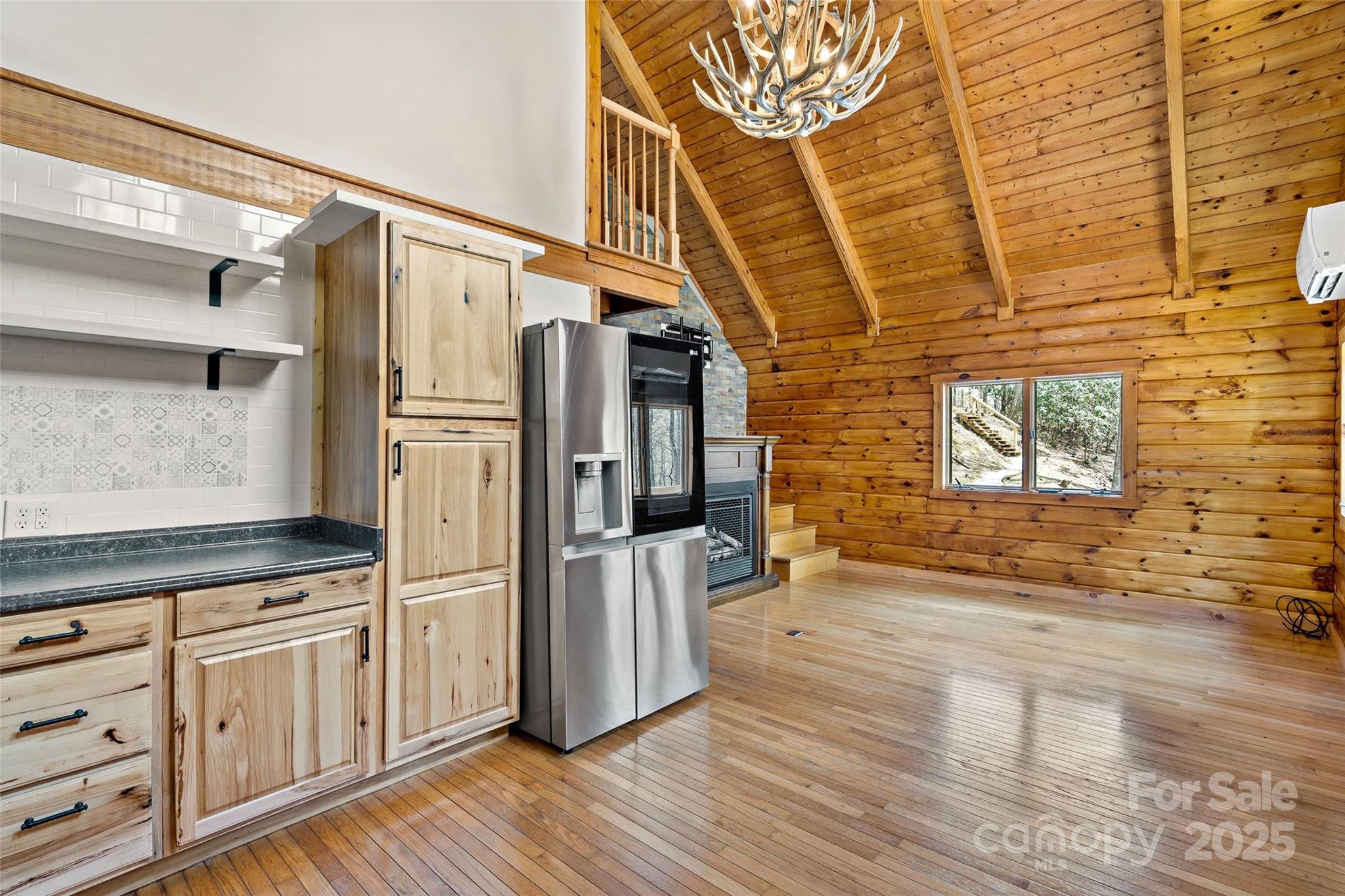 580 Red Dirt Road Newland, NC 28657 - Photo 15 of 48 a view of a refrigerator in kitchen and wooden floor