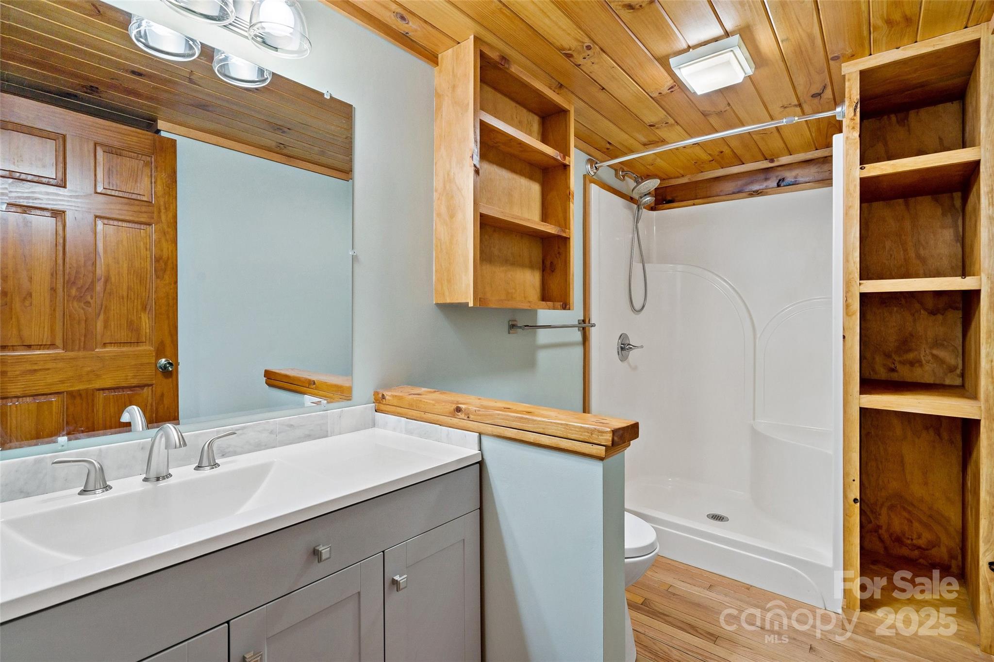 580 Red Dirt Road Newland, NC 28657 - Photo 20 of 48 a bathroom with a sink and a mirror