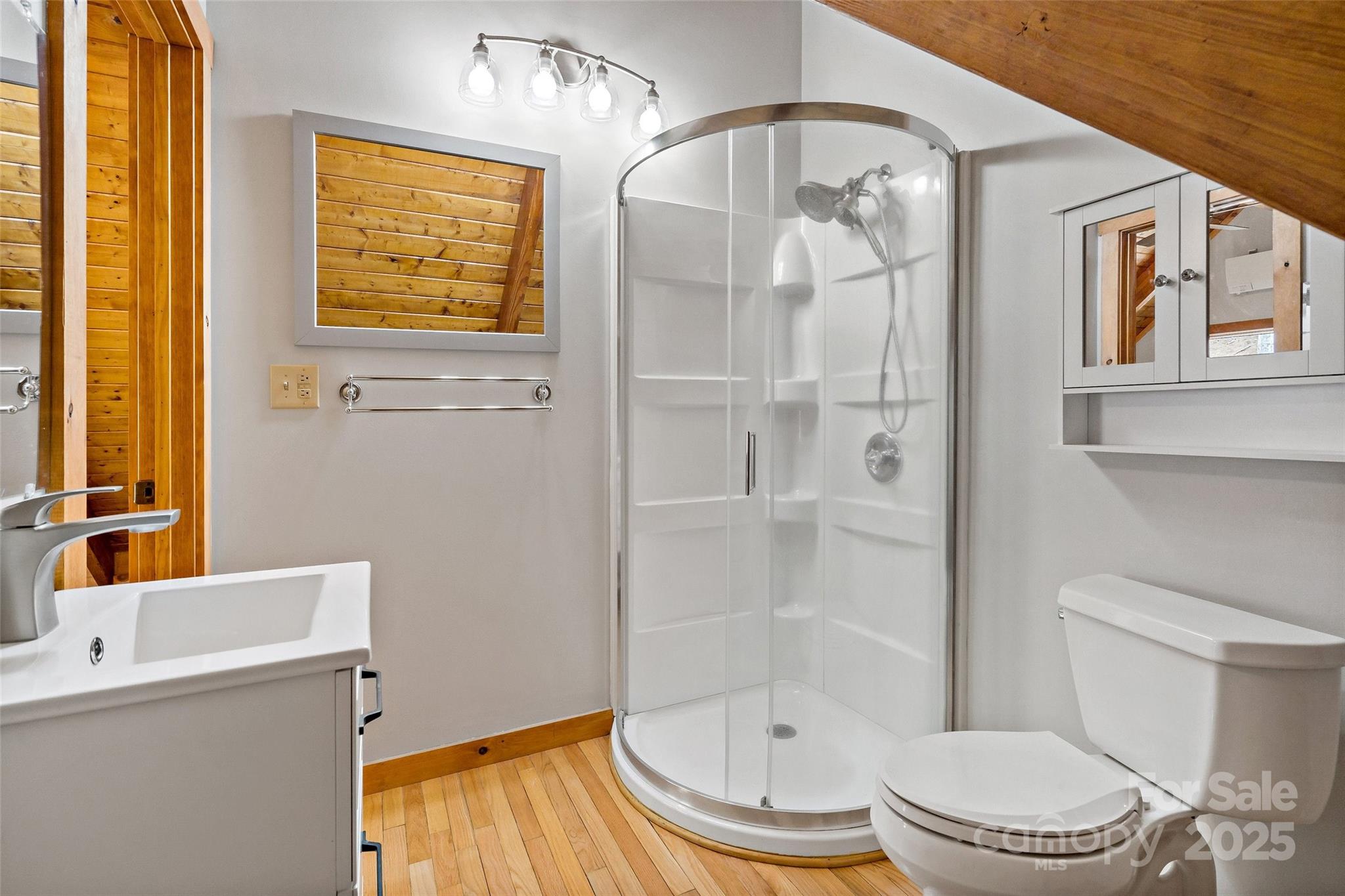 580 Red Dirt Road Newland, NC 28657 - Photo 28 of 48 a white toilet sitting next to a bathroom sink and a tub