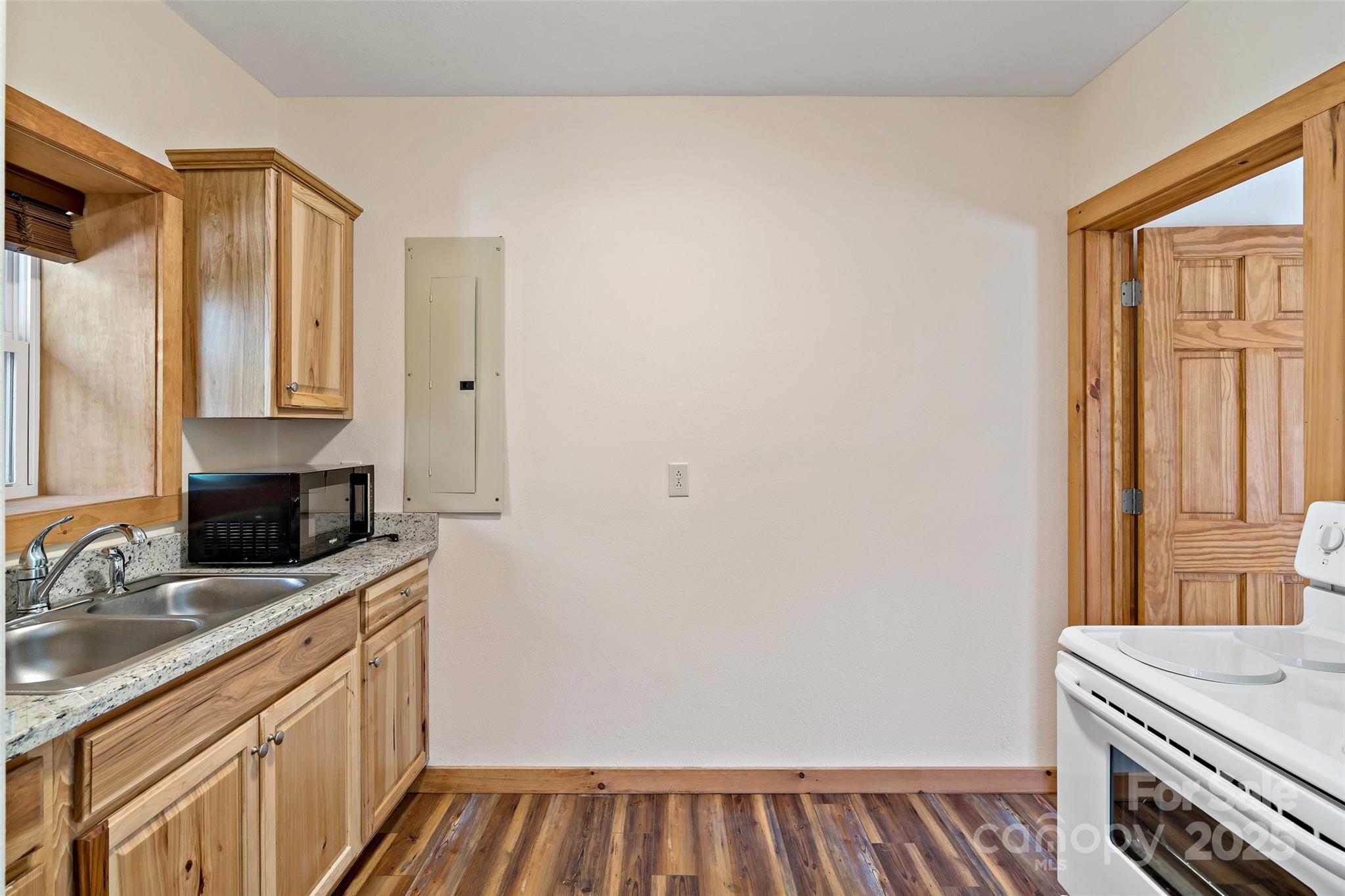 580 Red Dirt Road Newland, NC 28657 - Photo 32 of 48 a kitchen with a sink and a refrigerator