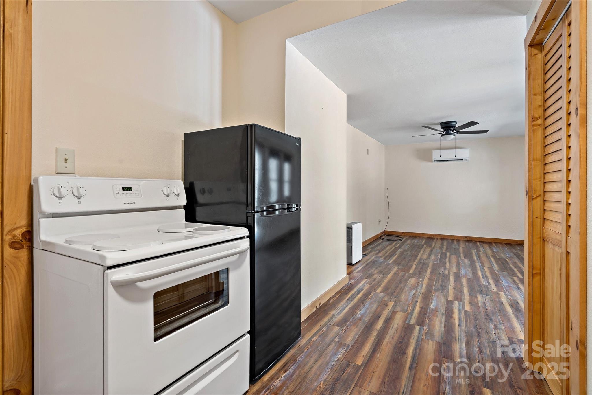 580 Red Dirt Road Newland, NC 28657 - Photo 33 of 48 a kitchen with a stove and wooden floor