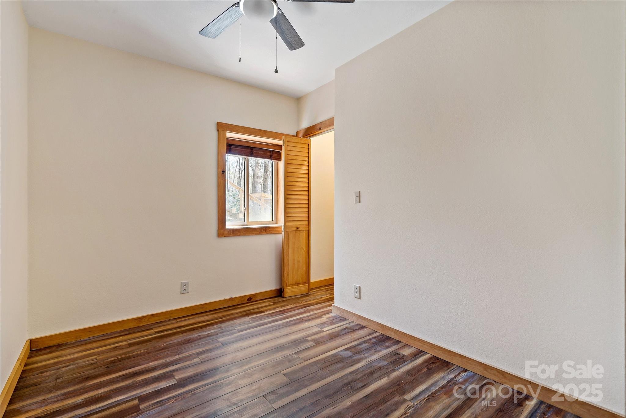 580 Red Dirt Road Newland, NC 28657 - Photo 35 of 48 a view of empty room with wooden floor