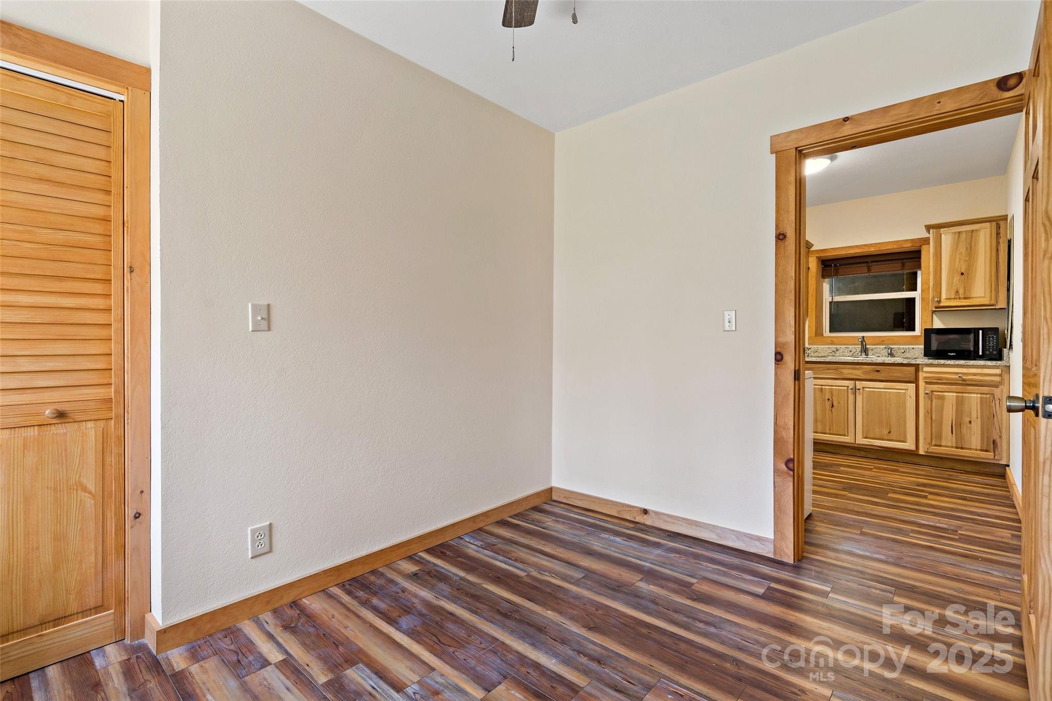 580 Red Dirt Road Newland, NC 28657 - Photo 36 of 48 a view of a room with wooden floor