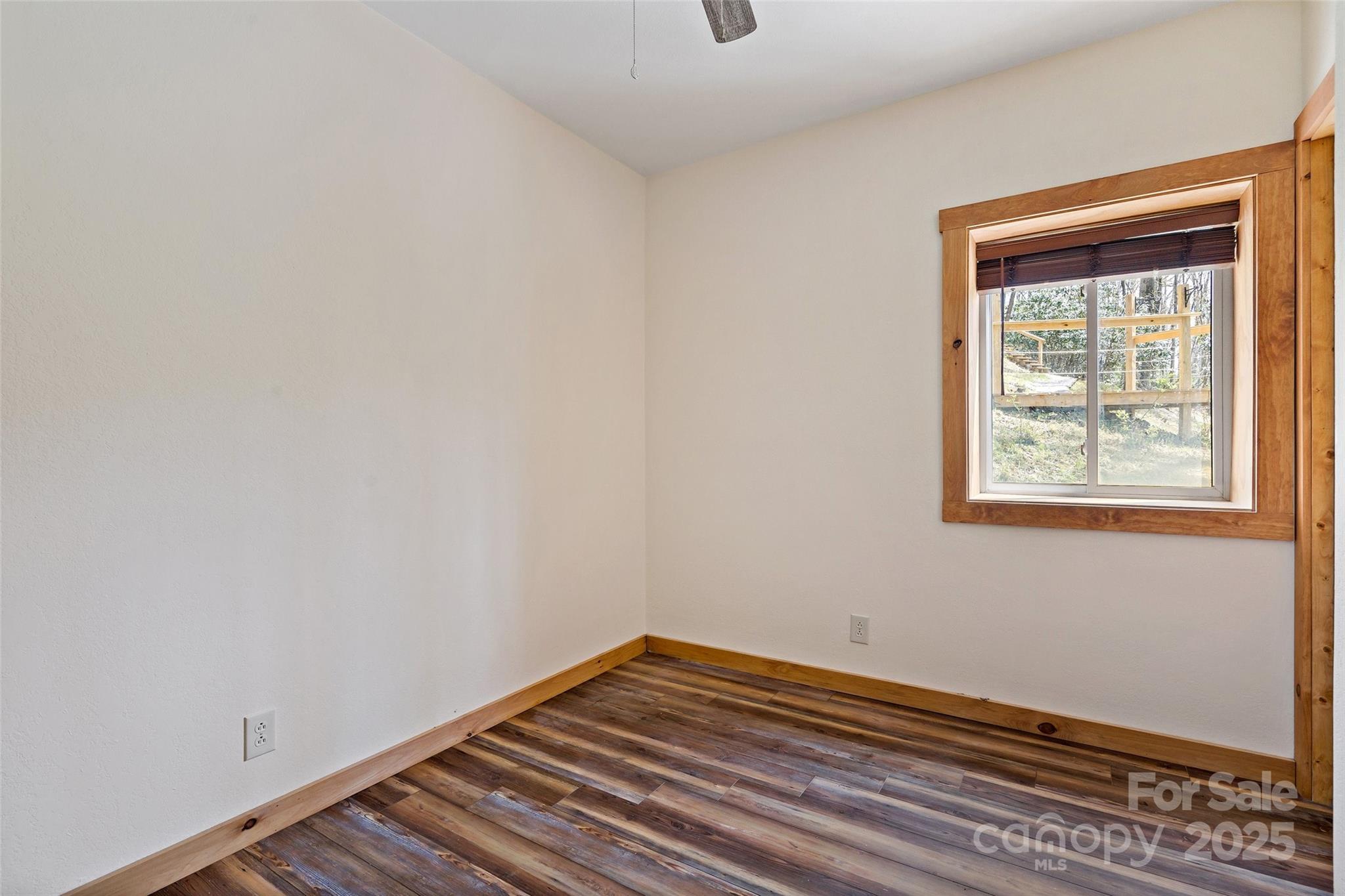 580 Red Dirt Road Newland, NC 28657 - Photo 37 of 48 a view of a room with wooden floor and a window