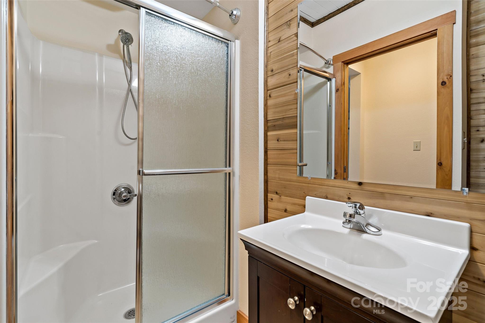 580 Red Dirt Road Newland, NC 28657 - Photo 38 of 48 a bathroom with a sink and a mirror