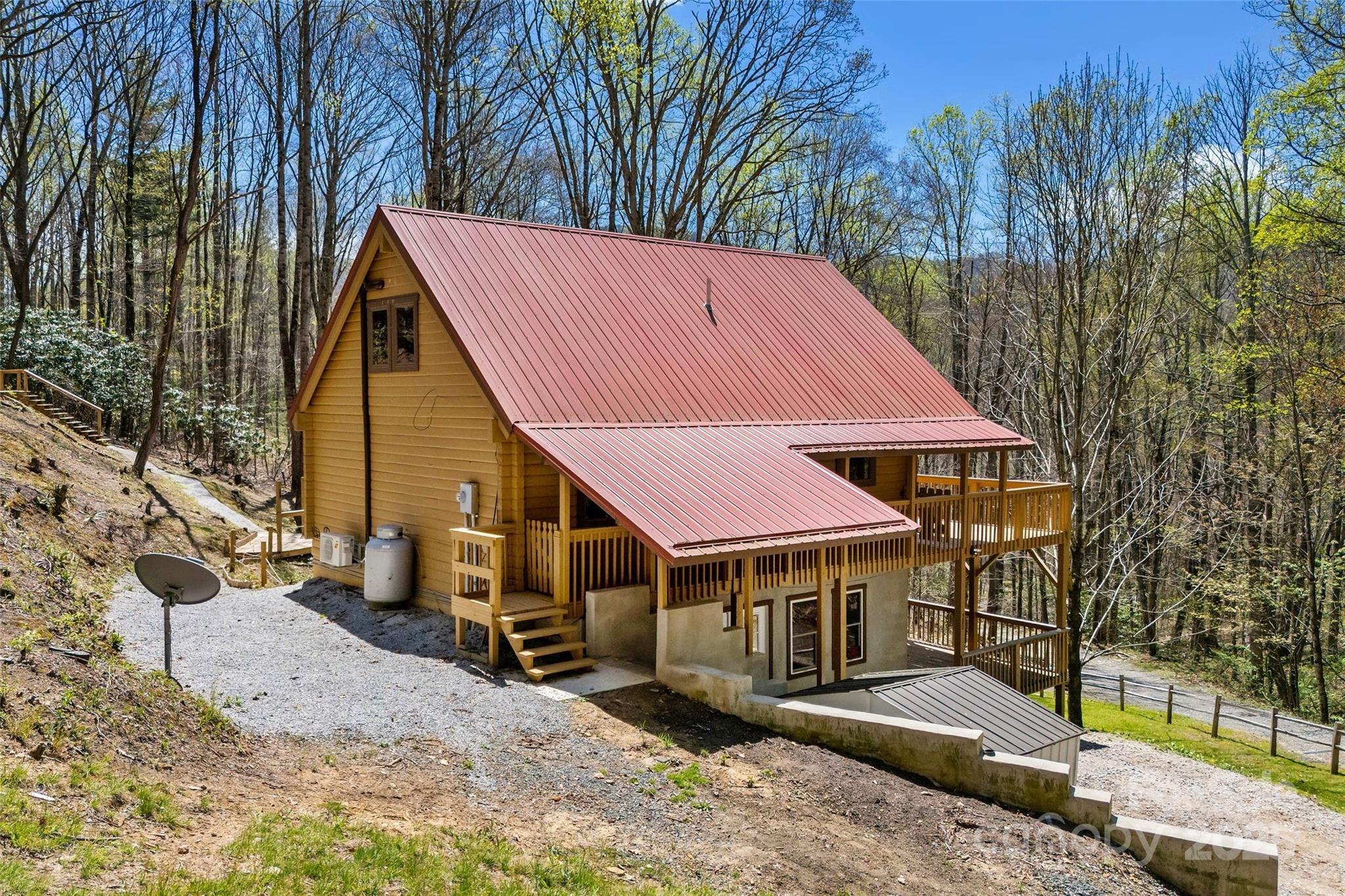 580 Red Dirt Road Newland, NC 28657 - Photo 4 of 48 a view of a house with a yard