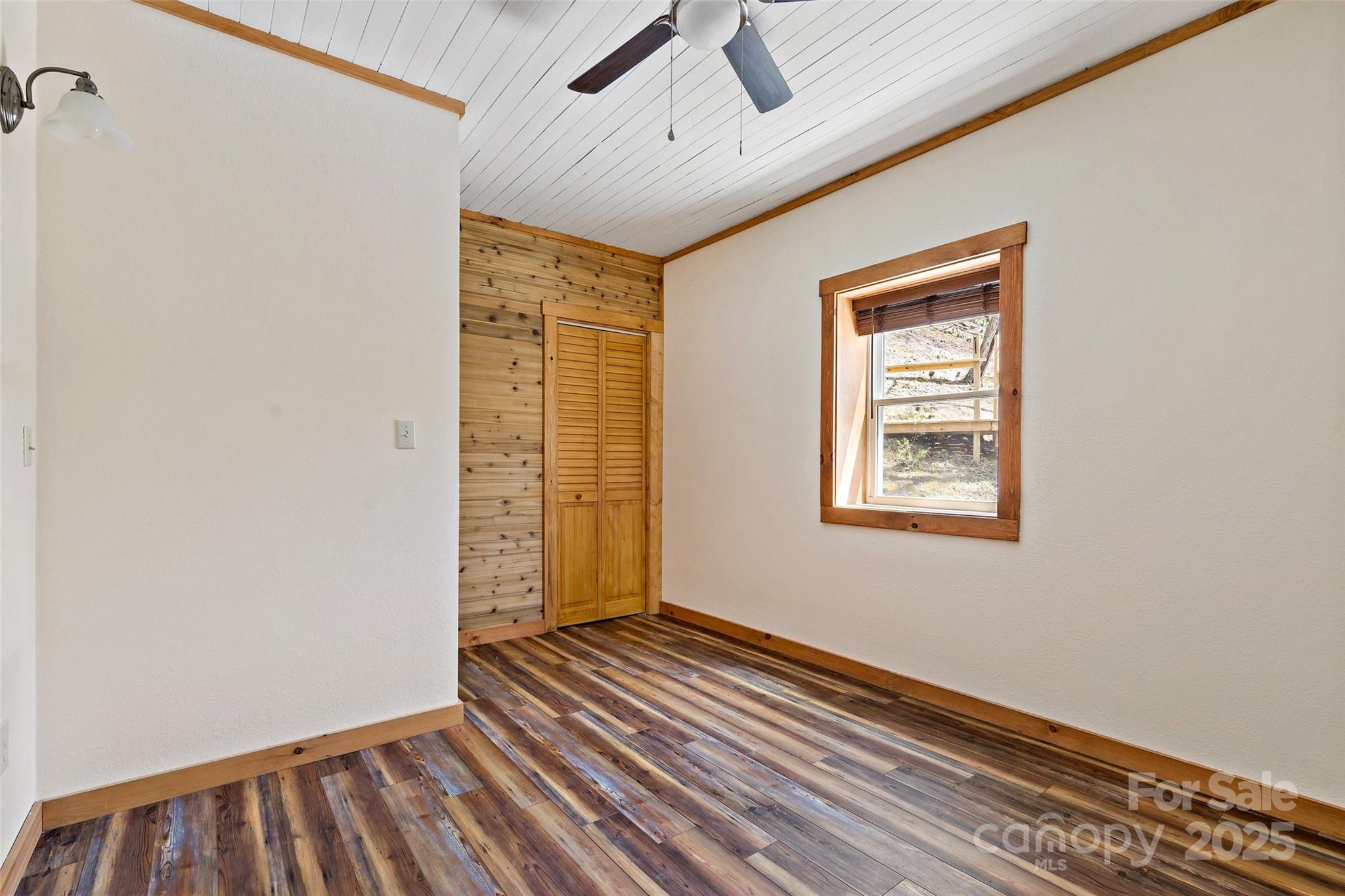 580 Red Dirt Road Newland, NC 28657 - Photo 41 of 48 a view of an empty room with a window
