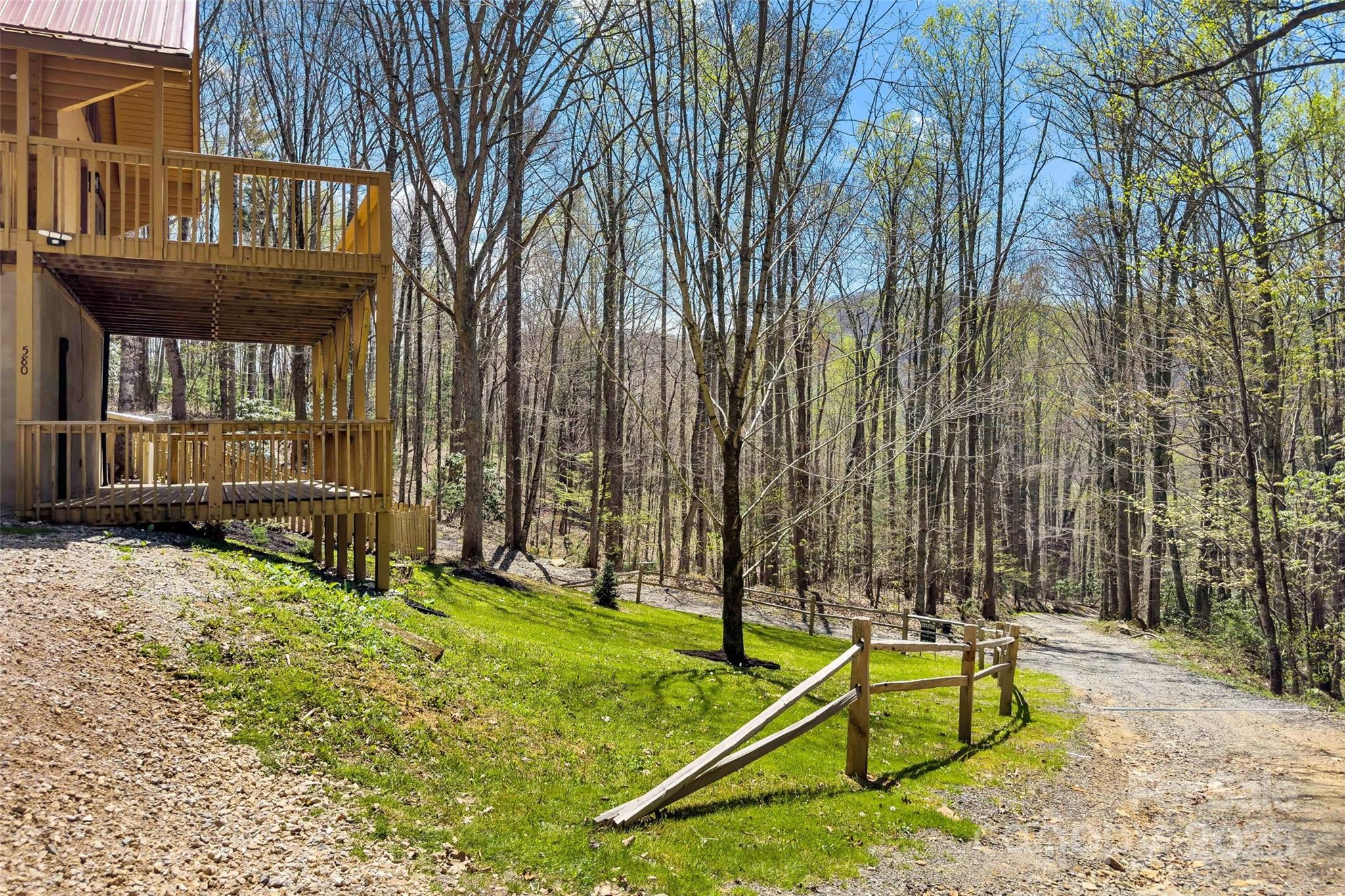 580 Red Dirt Road Newland, NC 28657 - Photo 44 of 48 a view of an house with backyard and sitting area