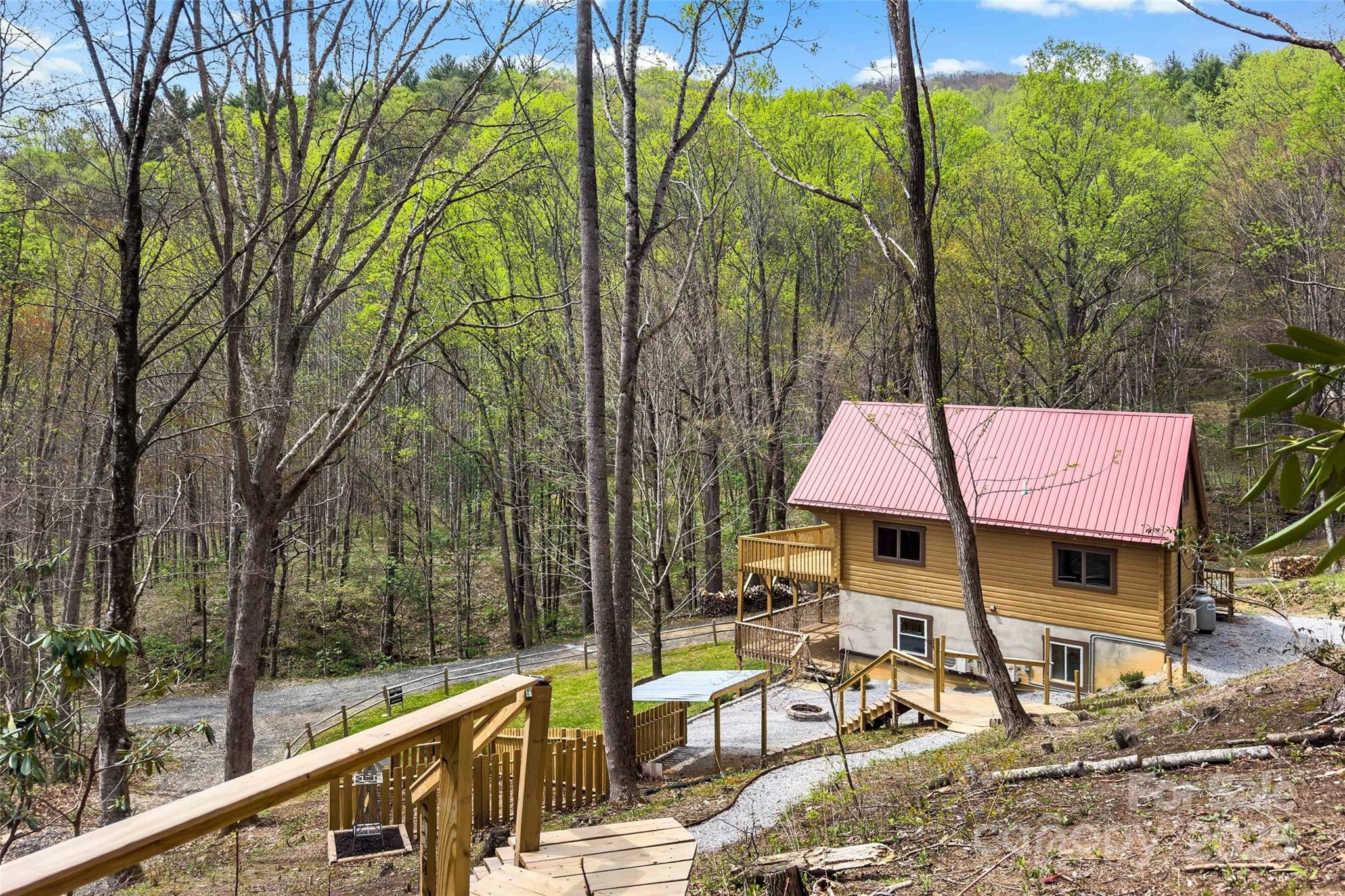580 Red Dirt Road Newland, NC 28657 - Photo 46 of 48 a view of a dinning table and chairs in the patio
