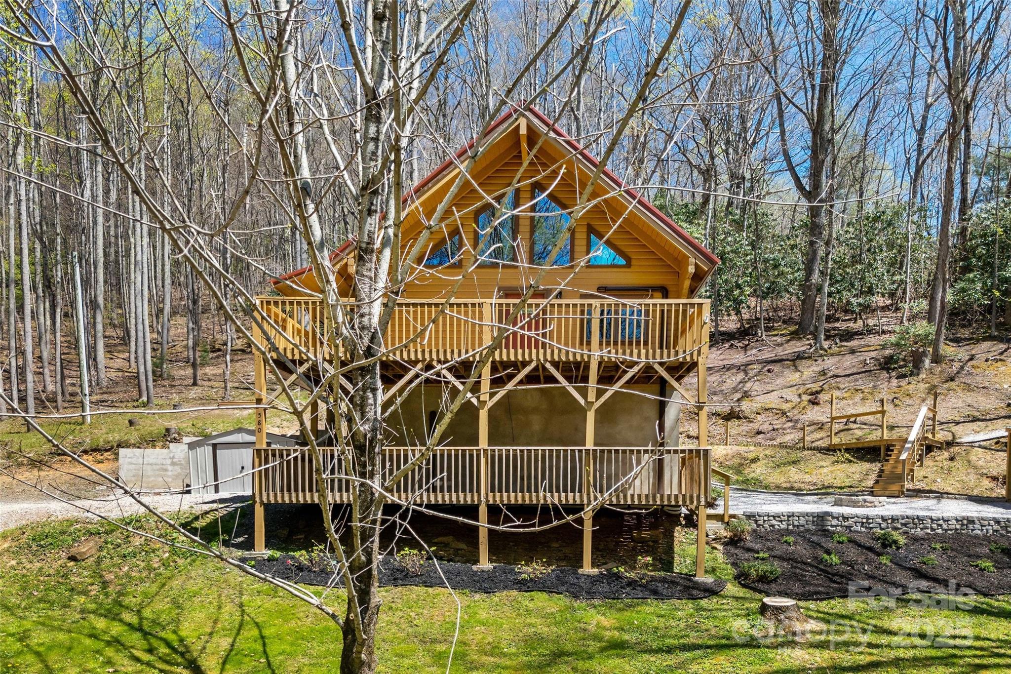 580 Red Dirt Road Newland, NC 28657 - Photo 5 of 48 front view of a house with swimming pool