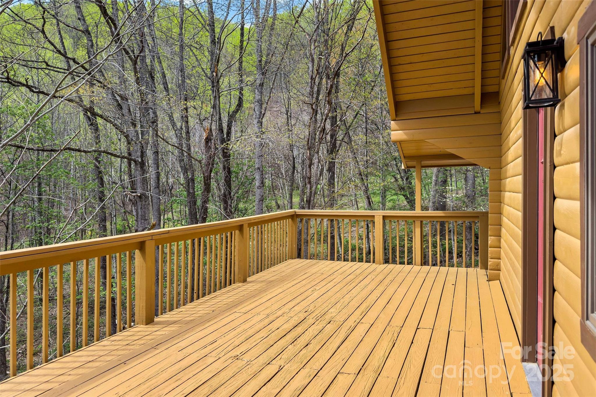580 Red Dirt Road Newland, NC 28657 - Photo 8 of 48 a view of balcony with wooden floor and fence