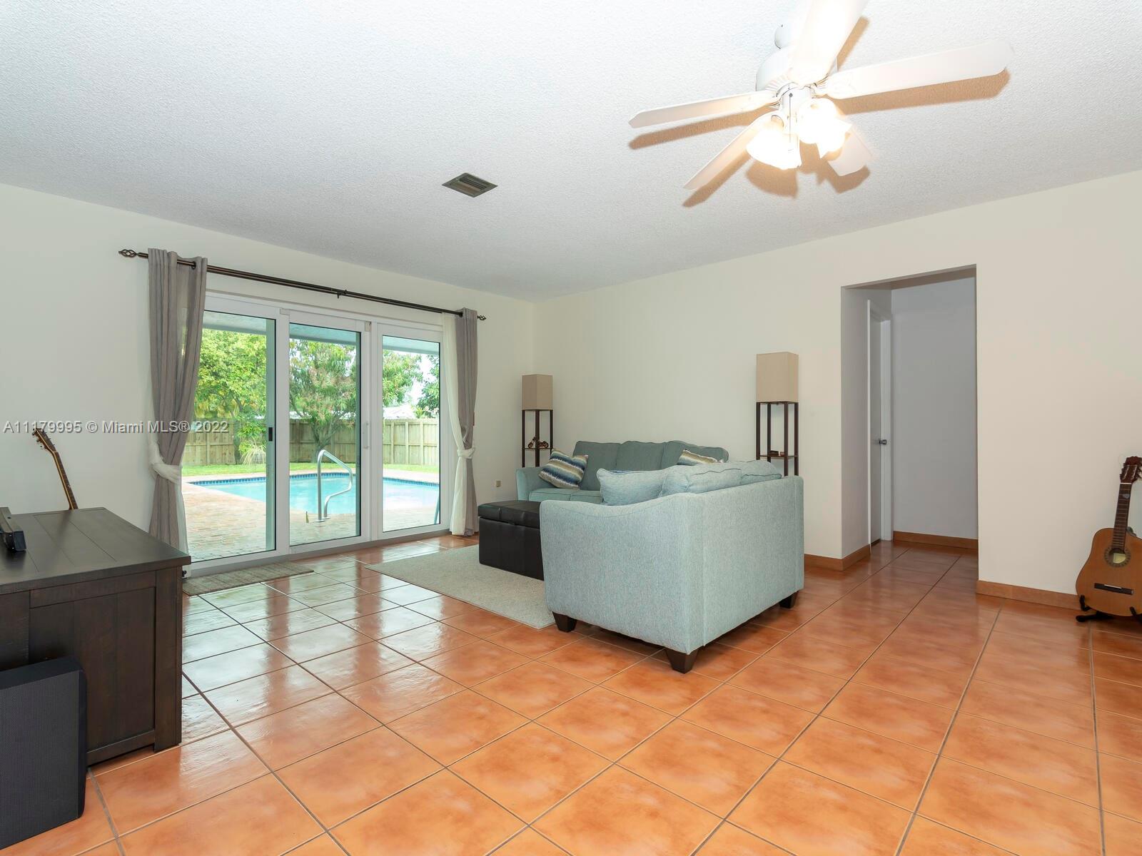 4401 West Park Road Hollywood, FL 33021 - Photo 5 of 23 a living room with furniture and a window