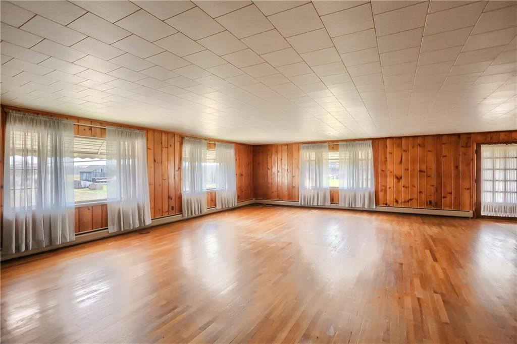 1215 Mt Jackson Road New Castle, PA 16102 - Photo 3 of 24 an empty room with wooden floor and windows