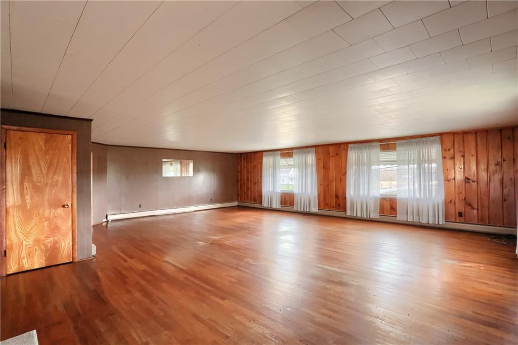 1215 Mt Jackson Road New Castle, PA 16102 - Photo 4 of 24 an empty room with wooden floor and windows