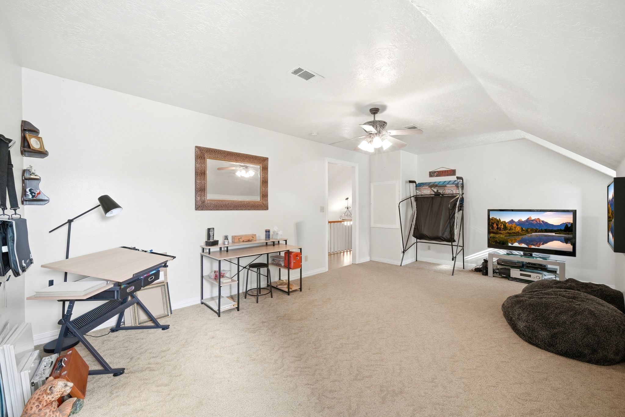 144 Wood Farm Road Huntsville, TX 77320 - Photo 30 of 50 a view of a livingroom with furniture and a flat screen tv