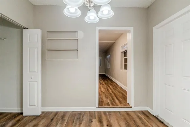 a view of an entryway with wooden floor