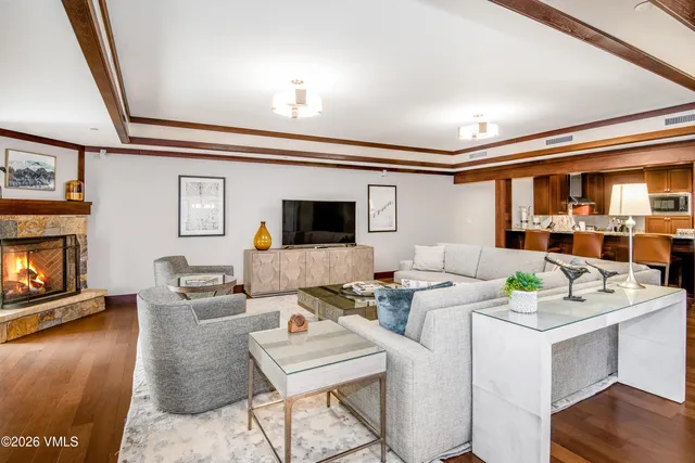 a living room with fireplace furniture and a flat screen tv