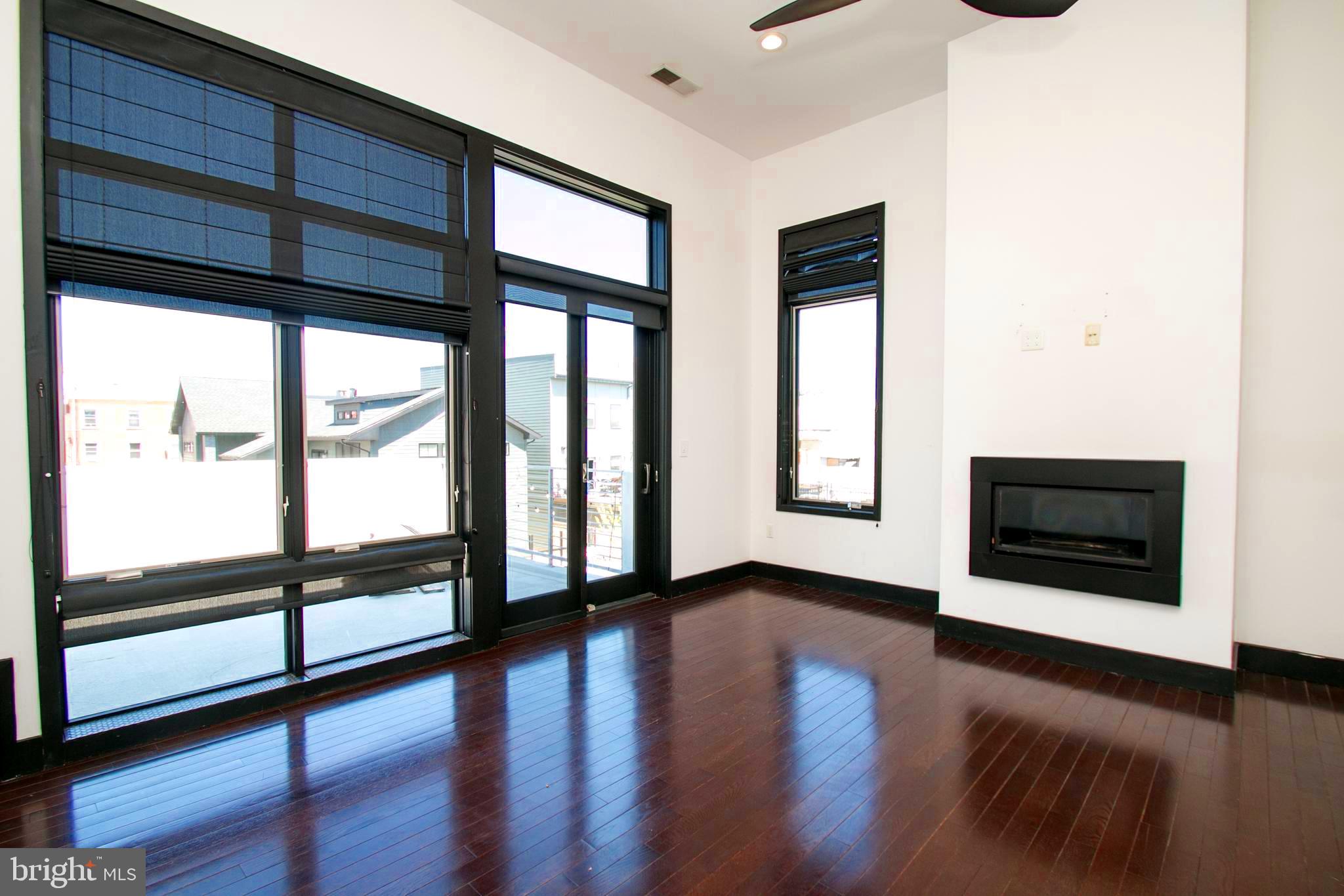 243 Tasker Street Philadelphia, PA 19148 - Photo 28 of 75 Master bedroom with fire place and ext. patio.