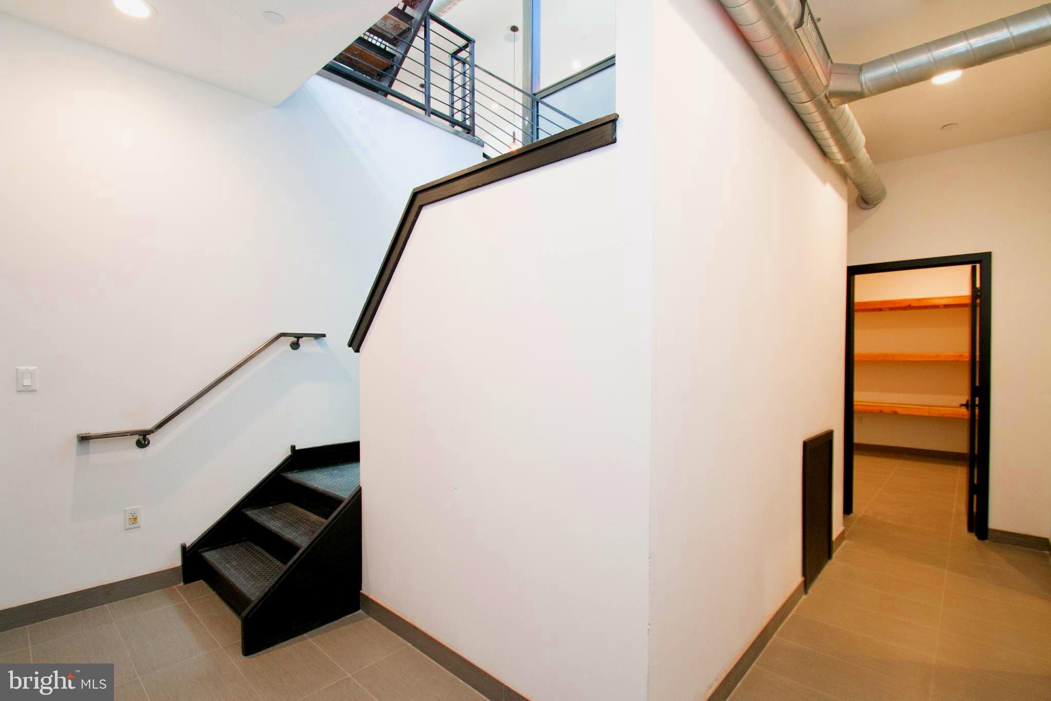 243 Tasker Street Philadelphia, PA 19148 - Photo 59 of 75 Open stairs leading to the basement area.