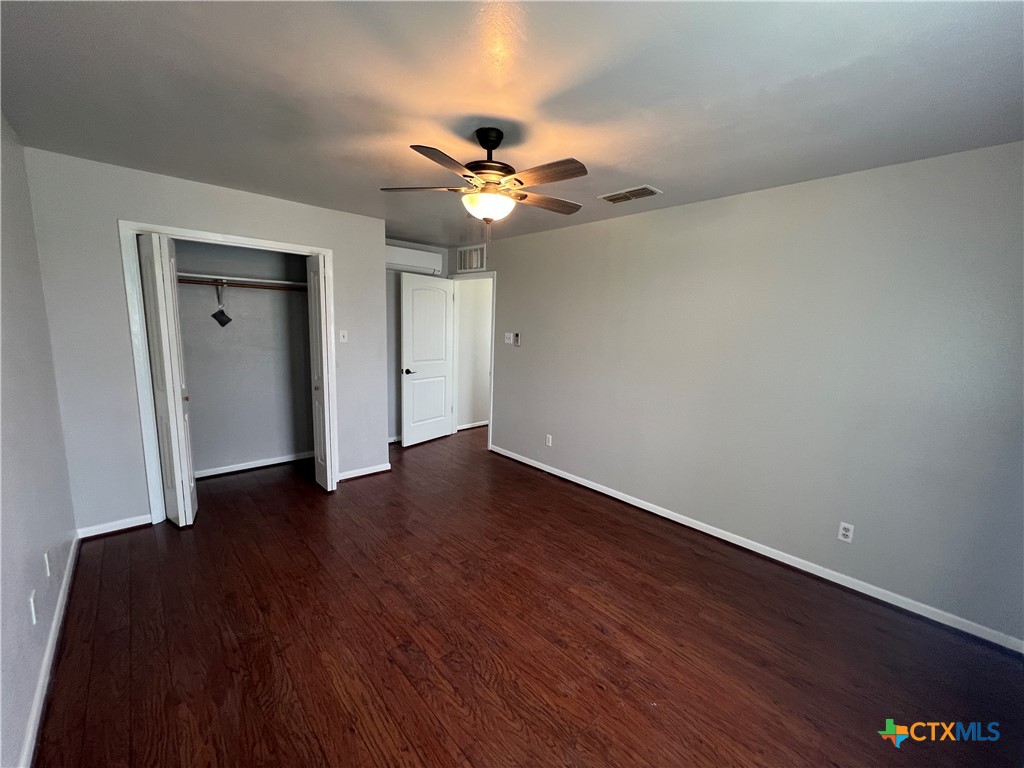 2955 East Amity Road Salado, TX 76571 - Photo 18 of 19 a view of an empty room with wooden floor