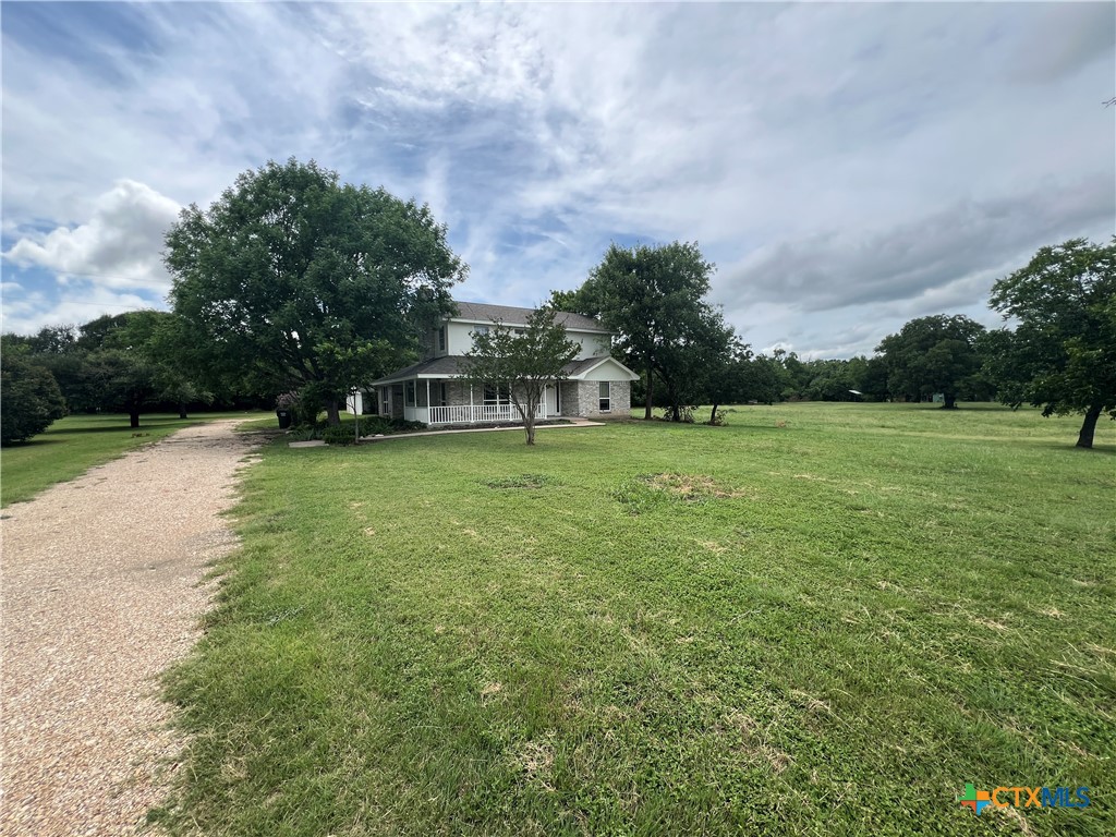 2955 East Amity Road Salado, TX 76571 - Photo 19 of 19 a view of a house with a big yard and large trees