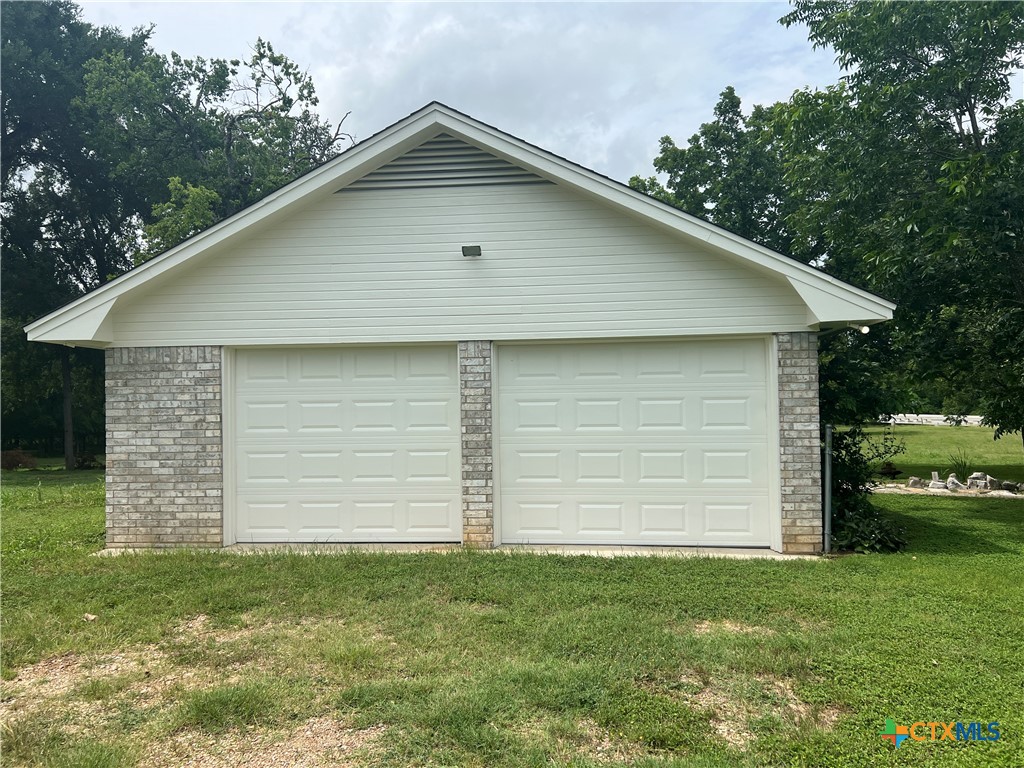 2955 East Amity Road Salado, TX 76571 - Photo 2 of 19 a front view of a house with a garden and yard