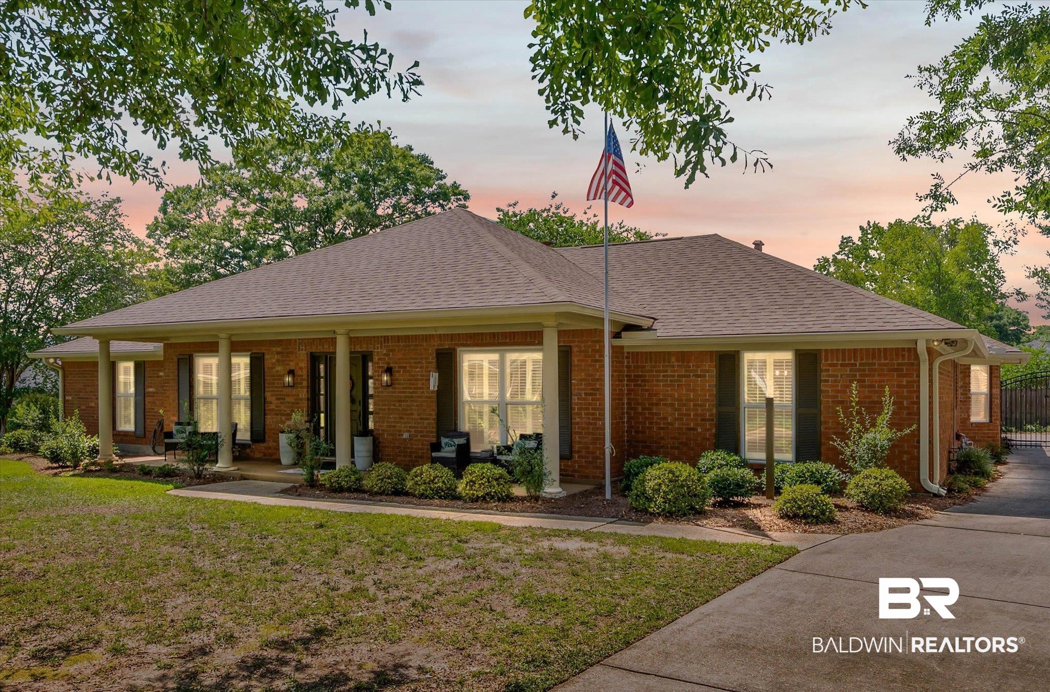 7410 Smithfield Road East Mobile, AL 36695 - Photo 1 of 24 Brick exterior with a covered front porch, supported by columns