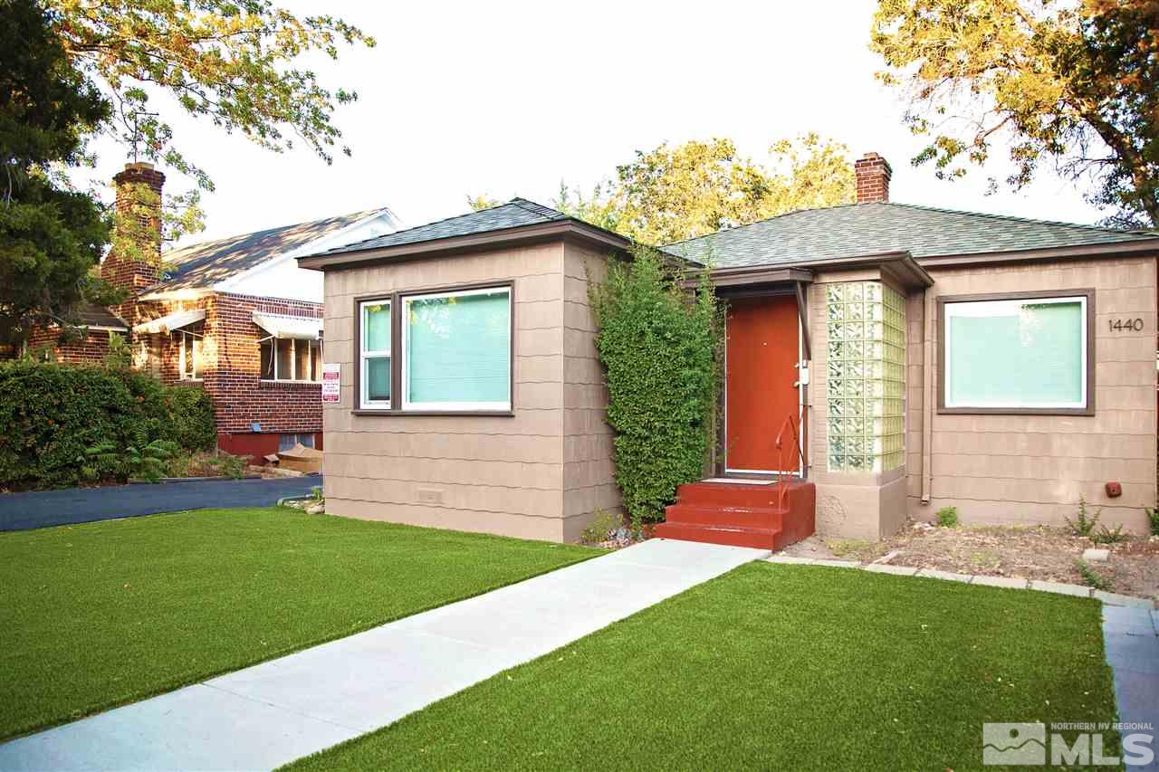 1440 Lander Street Reno, NV 89509 - Photo 1 of 22 a front view of a house with a garden and yard