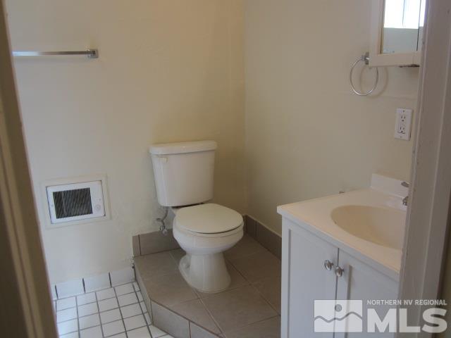 1440 Lander Street Reno, NV 89509 - Photo 20 of 22 a bathroom with a toilet and a sink