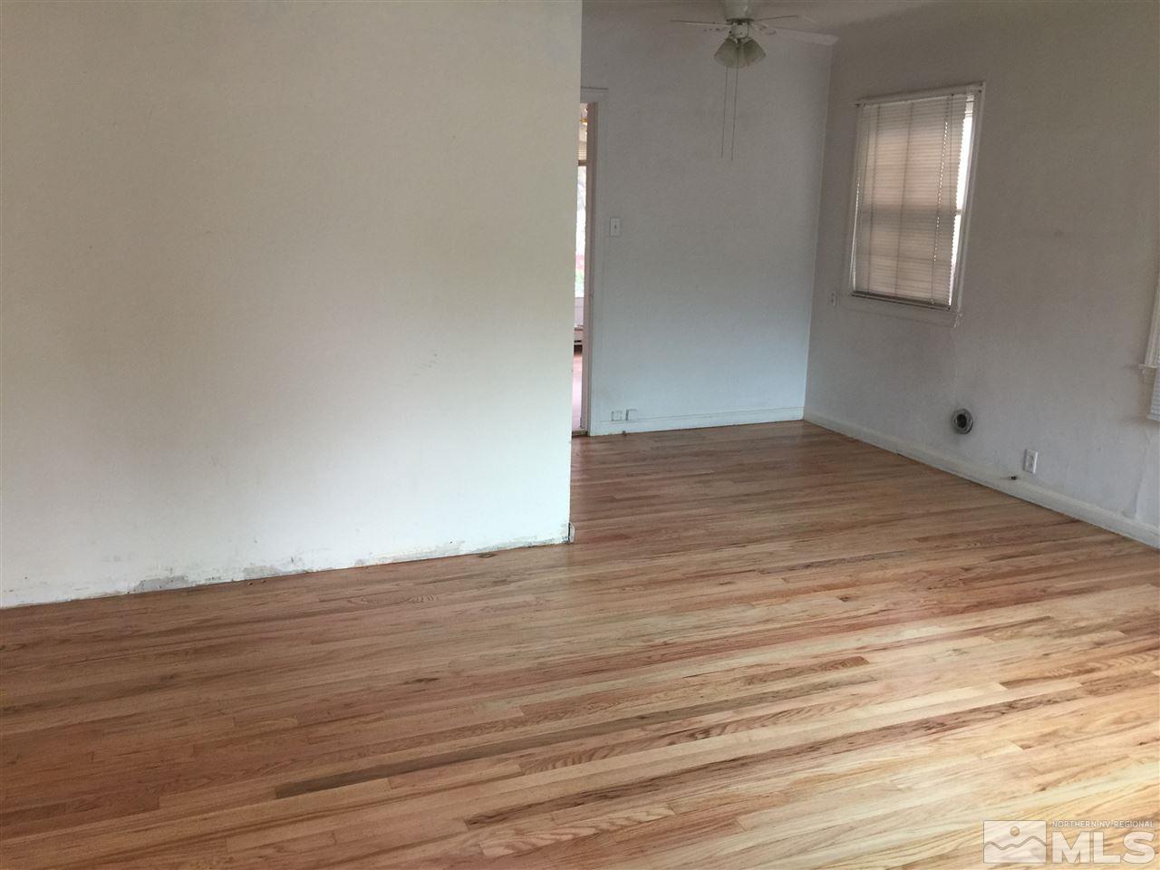 1440 Lander Street Reno, NV 89509 - Photo 2 of 22 a view of an empty room with wooden floor