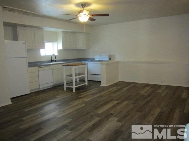 1440 Lander Street Reno, NV 89509 - Photo 22 of 22 a room with a wooden floor and white walls